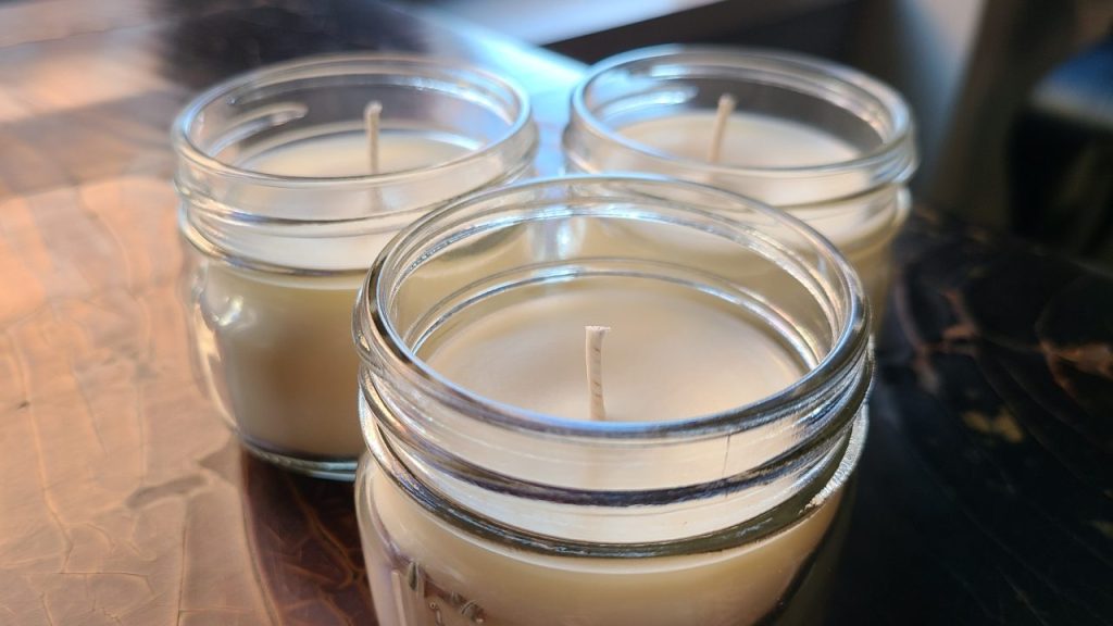 Newly crafted soy candles made with essential oils after a few days of curing.